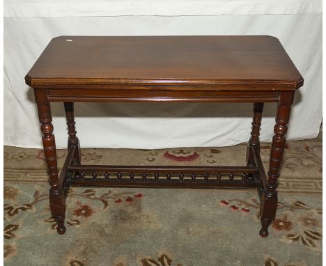 A late Victorian mahogany turn over top card table