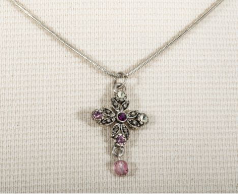 A silver cross set with rose quartz and chain