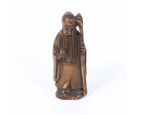 A hand carved hardwood netsuke of Chinese immortal