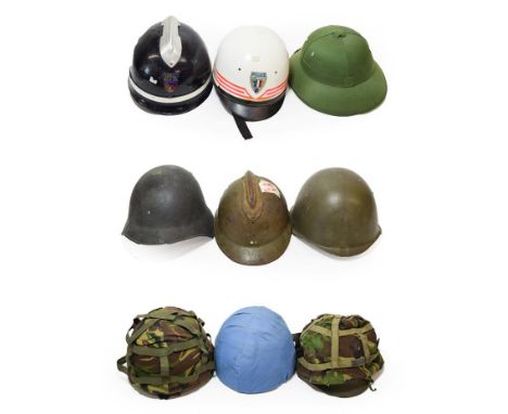 A Swiss Combat Helmet, with leather cushioned three pad liner; a US Combat Helmet, with leather liner and chinstrap; two NATO