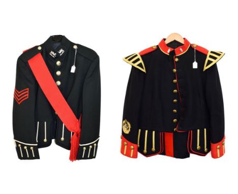A Black Watch Piper's Blue Doublet, with red collar, shoulder tabs, cuffs and piping, staybrite collar badges and brass butto