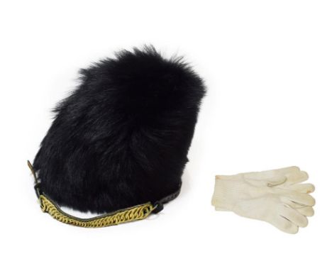 A British Guards Regiments Other Ranks Bearskin Cap, of black synthetic fur, with wicker frame, leather sweatband, label date