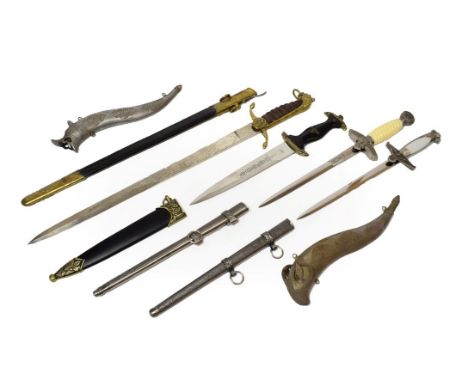 A Copy of a British Naval Dirk, with brass mounted leather scabbard; three Copy Third Reich Daggers, with scabbards; two Indi