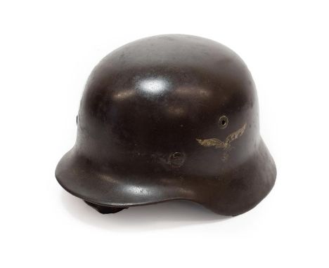 A German Third Reich M35 Double Decal Luftwaffe Helmet, with brown/grey finish, Luftwaffe and National tricolour shield decal