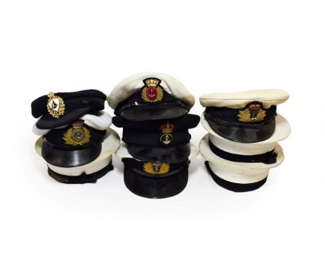 Three Elizabeth II Royal Navy Peaked Caps, each with raised bullion thread embroidered badge, woven mohair band and black pat