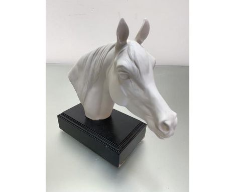 A Goebel West German porcelain moulded head of a horse mounted on ebonised stand, label verso, (h 24cm x L 23cm x w 7cm - inc
