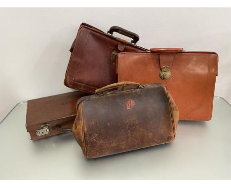 A group of four vintage leather cases including a Gladstone style bag, two large document carrying cases, (39cm (with handle)