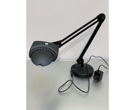 A daylight anglepoise style natural lamp with magnifying lens on adjustable arm and circular weighted base, complete with ful