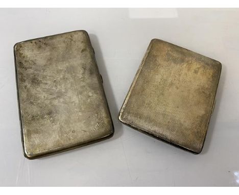 A silver cigarette case, London 1929, with initials WAS to bottom right, (13cm x 8.5cm), and another silver cigarette case, L
