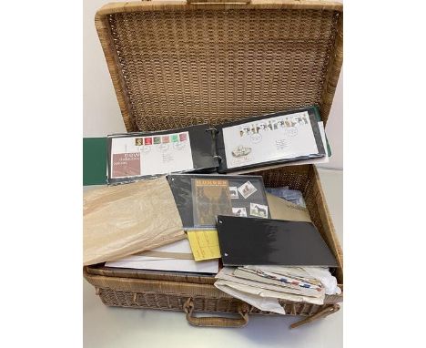 Wicker basket, 2 carrier bags and a folder containing a mix of stamps, first day covers supplies etc, a quantity