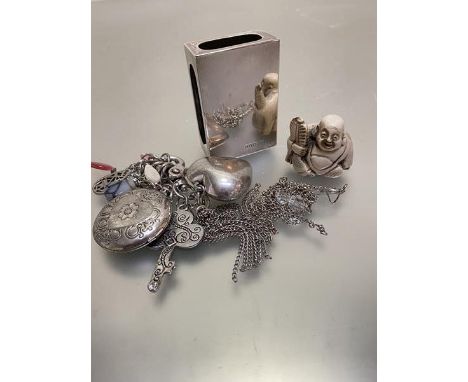 An Edwardian silver match box cover, London 1919 (7cm x 3cm x 5cm), a white metal chain containing miscellaneous charms etc, 