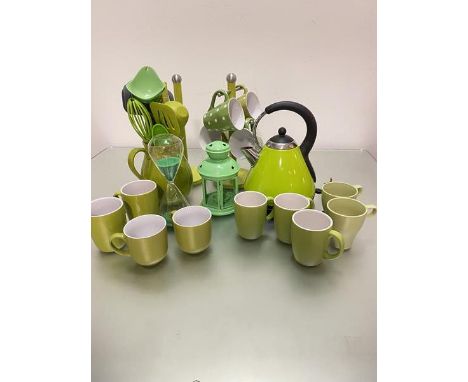 A collection of green kitchenalia including an electric kettle, a collection of Maxwell Williams sprinkle mugs, miscellaneous