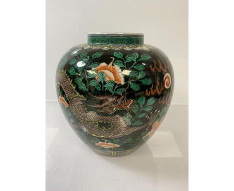 A Chinese ginger jar with dragons and flaming pearl in foliate setting, six blue character marks to base, (h 18cm)