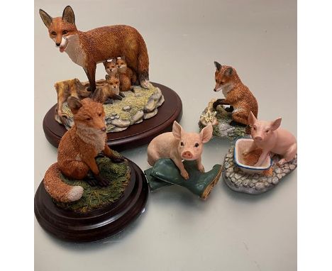 A collection of composition made animal figures including Border Fine Arts Feed Time 1996, James Heriot Collection, Endangere