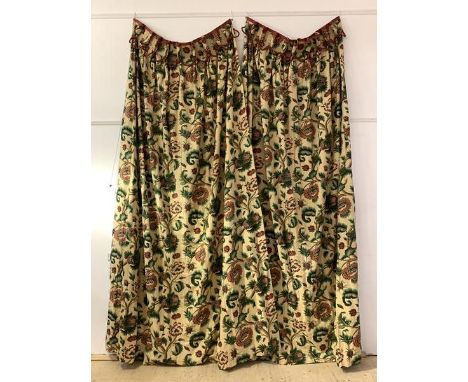 A Large pair of lined and interlined country house curtains, the pale gold field with foliate design, with a pair of red tass