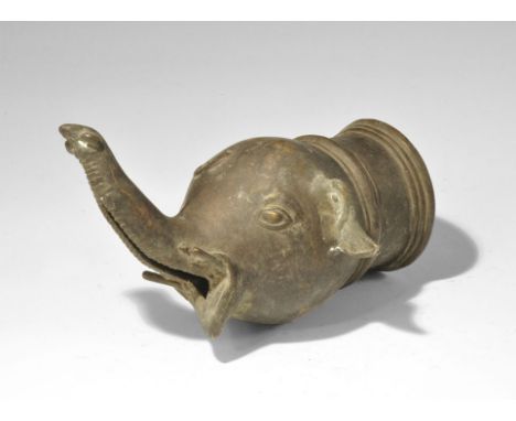 India, 19th-early 20th century AD. A hollow-cast spout finial formed as an elephant's head with ribbed collar, open mouth, ra
