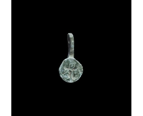 13th-15th century AD. A discoid seal matrix with parallel lentoid-section shank and suspension loop; the face with intaglio h