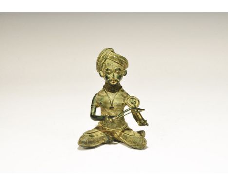 India, 19th-early 20th century AD. A figurine of bearded male with turban and dhoti, with necklace pendant; playing a violin 