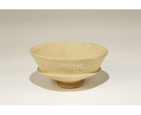 1st millennium BC. A terracotta bowl with small discoid foot, carinated profile. 404 grams, 17cm (6 3/4"). Ex The Millennia E