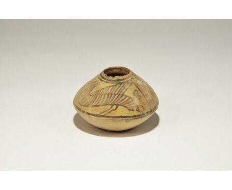 3300-1700 BC. A biconical terracotta jar with polychrome frieze of birds and geometric panels. 160 grams, 10cm (4"). Private 