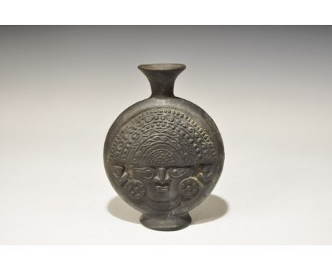 An undated archaistic blackware flask with facing bust to each broad face, flared base and neck; face with D-shaped headdress