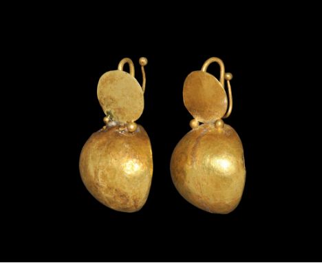 2nd-3rd century AD. A matched pair of drop earrings, each a S-shaped hook with knop finial, discoid plaque with granules belo
