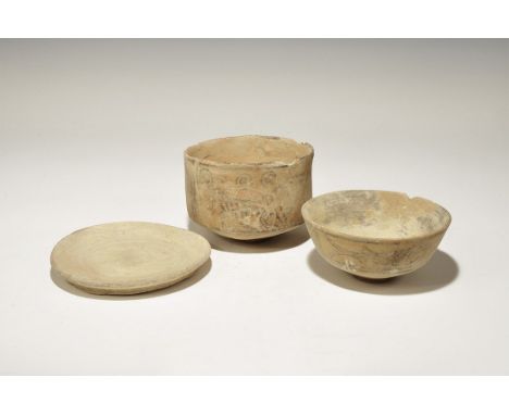 3300-1700 BC. A mixed group comprising: a footed bowl with polychrome fish to the outer face; a dished plate with rosette mot