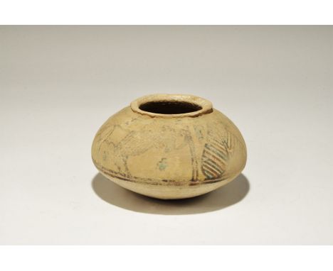 3300-1700 BC. A squat terracotta jar with everted rim, band of polychrome ornament to the shoulder with lions, peepal leaf an