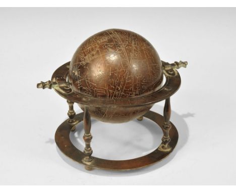 India, 19th century AD. A hollow globe mounted within a flat-section ring supported by four balustered legs on a lower ring w