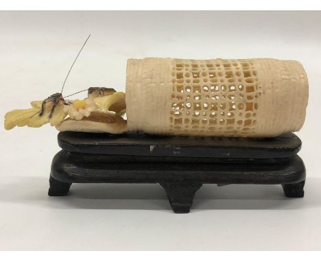 Chinese Bone Basket Late 1800s, placed (but not glued) inside is a colorful flower branch with two cockroaches.  The item is 