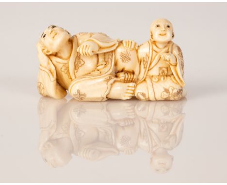 Old Bone Netsuke in the figure of Father & Son Resting.  Item illustrated by hand and signed.  Dimensions: 4X2X2 cm.