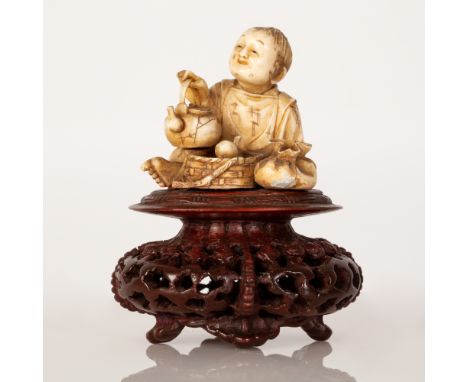 Japanese Okimono Bone Sculpture in the figure of an Adolescent Boy Having Breakfast.  The item is of very high quality, place