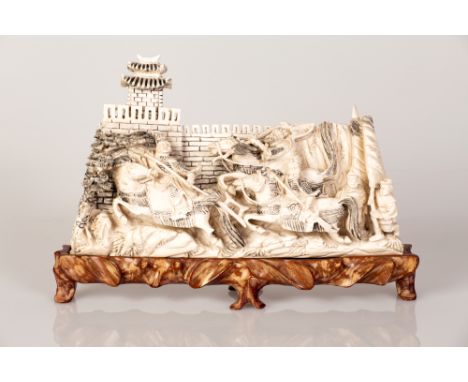 3D bone made carving , depicting a scene of combat at the feet of a castle.   Engraving crafting blackened on both item sides