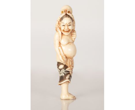 Old Japanese Bone Netsuke with a scene of a Man Holding an Octopus Over His Head.  Illustrated by hand.  Item in good conditi