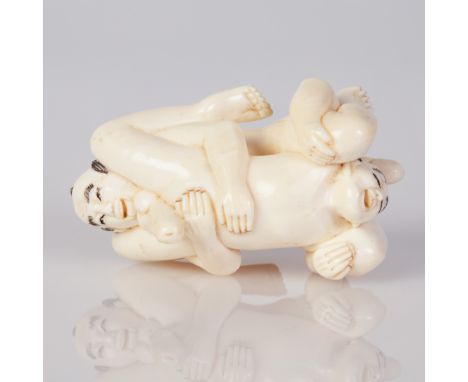 Japanese erotic Mammoth bone netsuke of a gay couple making love. Finely crafted and signed. Dimensions: 3/5 cm.