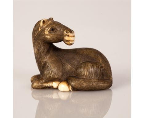 Old Japanese Bone Netsuke in the figure of a Horse Resting.  Item painted black in a very high level of carving and signed.  