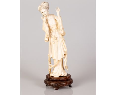 Chinese bone sculpture of an adolescent girl on a matching wooden stand set with silver threads.  Early 1920s.  Height includ
