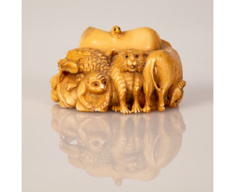 Bone Statuette in the figure of Different Animals Grouped Together.  All animals are with eyes set with black gemstones, a ve