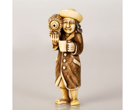 Bone netsuke in a scene of a Dutchman drinking wine from the jug. The item is unique and signed. Height: 7 cm.