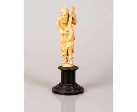 European Bone Statuette in the figure of a Mandolin Player on a wooden stand.  Charming special item.  Height: 18 cm.