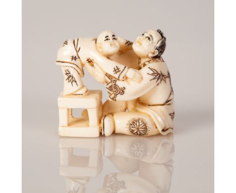Old Bone Netsuke with a scene of a Father Playing with His Son.  Item illustrated by hand and signed.  Dimensions: 3X2X2 cm.