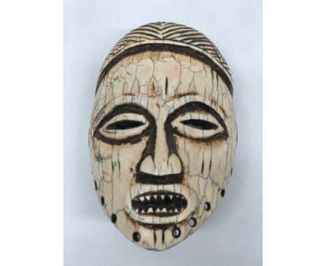 An African Tribal Ornamental Bone Mask in the Figure of a Man, apparently Republic of Congo, 19th Century. Item in good condi