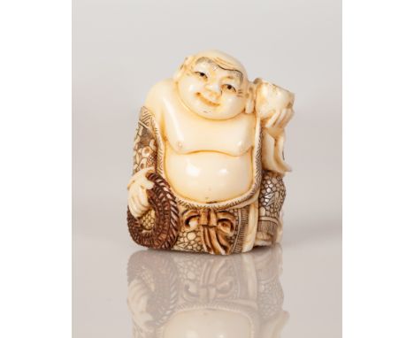 Bone netsuke in the figure of Buddha in traditional garments holding a jug.  Illustrated by hand and signed.  Dimensions: 5X3