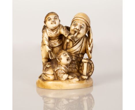 Japanese Okimono statuette bone in a scene of a man smoking a pipe with children, very high quality item signed with a red ha