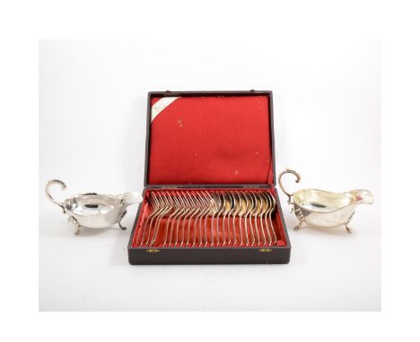 A tray of silver-plated flatware including a cased set of twelve Christofle table forks and table spoons in a French retailer