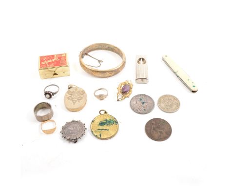 A small selection of silver items, to include a half hinged bangle with leaf design to the front, a flower ring with central 