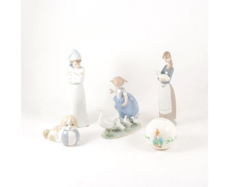 A quantity of Lladro, Nao and other Spanish pottery to include a Lladro dog with butterfly 6210, girl with geese, dog and flo