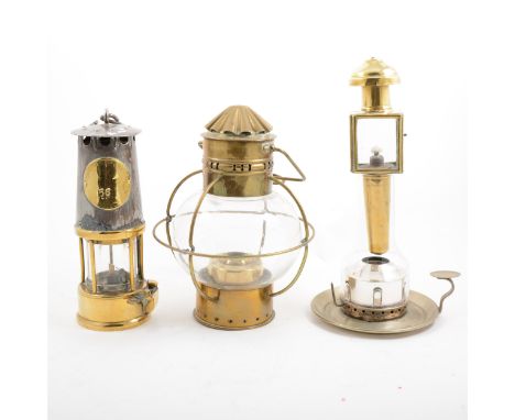 A miners lamp, hanging oil lamp with clear glass globe shade in brass metal wire frame, Miller &amp; Sons patent chamberstick
