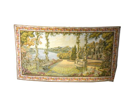 Machine-made tapestry wall hanging, Lakeside garden, rose garland border, 118 x 216cm, on a metal pole.