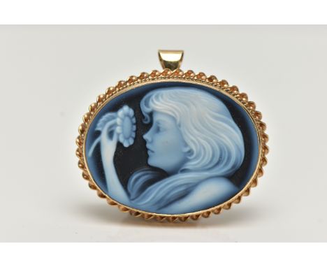 A 9CT GOLD CAMEO BROOCH, blue agate laser carved to depict a girl with a flower, set in a yellow gold collet setting  with a 